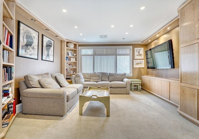 living room with built in features, recessed lighting, visible vents, wainscoting, and carpet flooring