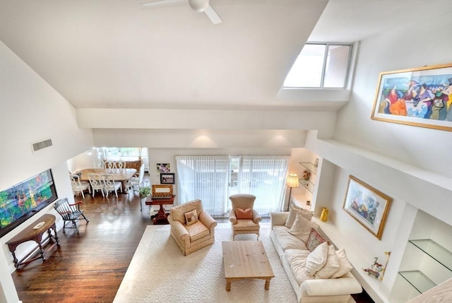 living room with high vaulted ceiling, ceiling fan, visible vents, and wood finished floors