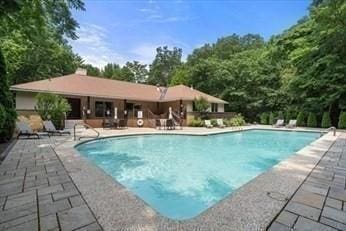 pool with a patio area