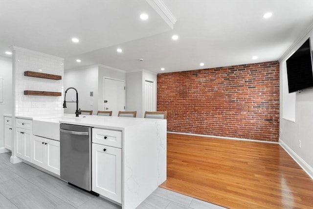 117 Fulton St Unit 4, Boston, MA 02109 - kitchen featuring dishwasher, brick wall, open shelves, white cabinetry, and recessed lighting