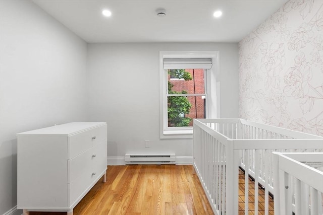 117 Fulton St Unit 4, Boston, MA 02109 - unfurnished bedroom with baseboard heating, recessed lighting, and light wood finished floors