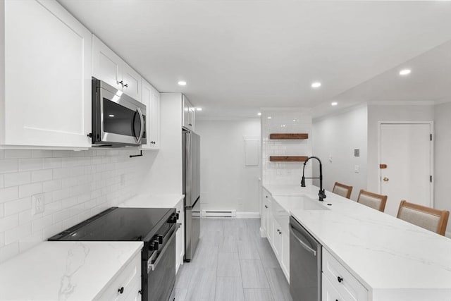 117 Fulton St Unit 4, Boston, MA 02109 - kitchen featuring stainless steel appliances, open shelves, crown molding, recessed lighting, and decorative backsplash
