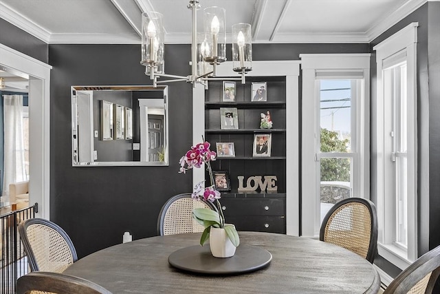 dining space with a notable chandelier and ornamental molding