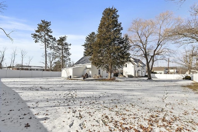 view of yard layered in snow