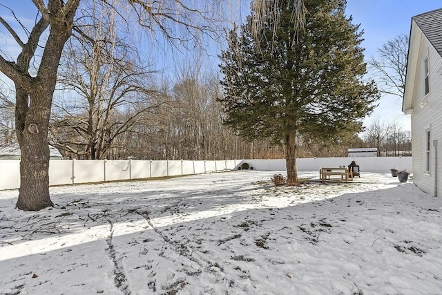 view of yard covered in snow