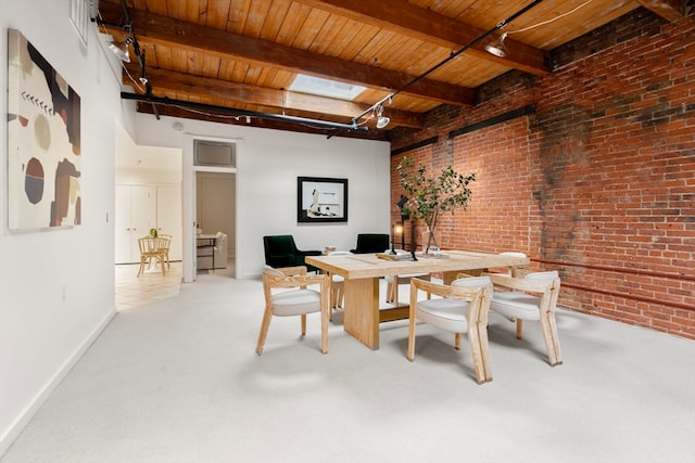 dining room featuring brick wall, a skylight, beam ceiling, and wooden ceiling