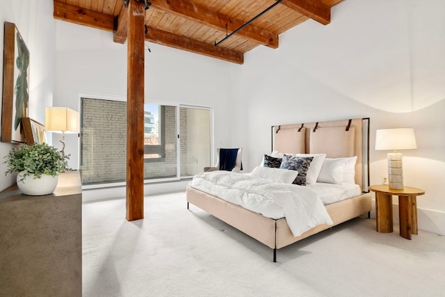 bedroom with high vaulted ceiling, wood ceiling, carpet flooring, and beamed ceiling