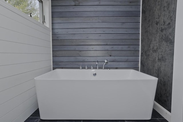 16 Poole Rd, Belchertown, MA 01007 - bathroom featuring wood walls and a freestanding bath