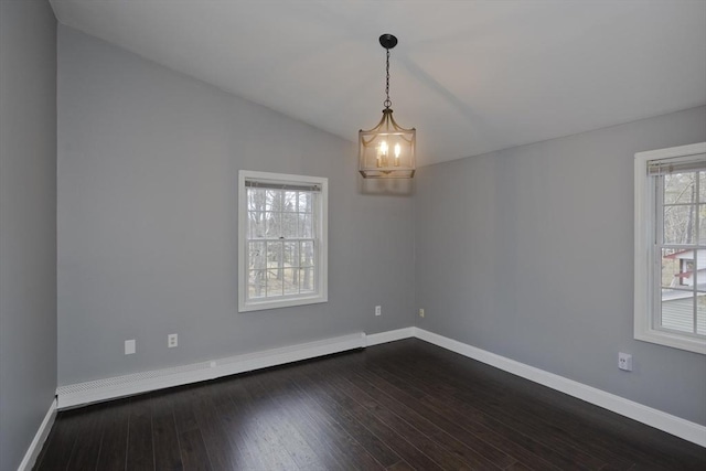 16 Poole Rd, Belchertown, MA 01007 - spare room featuring a chandelier, dark wood-type flooring, baseboard heating, and baseboards