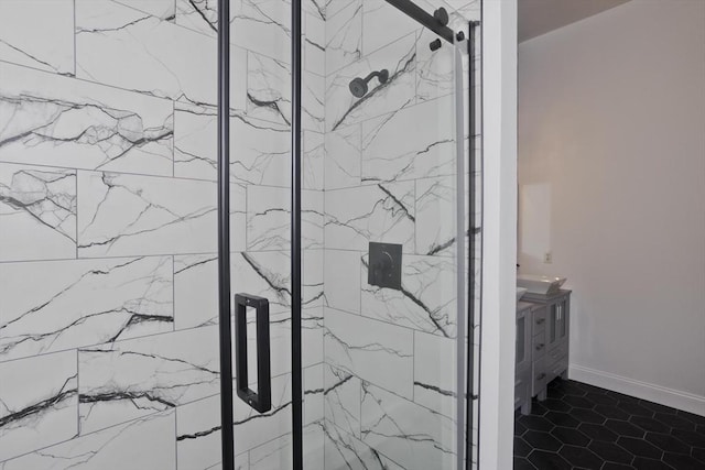 16 Poole Rd, Belchertown, MA 01007 - bathroom with a marble finish shower, baseboards, tile patterned flooring, and vanity