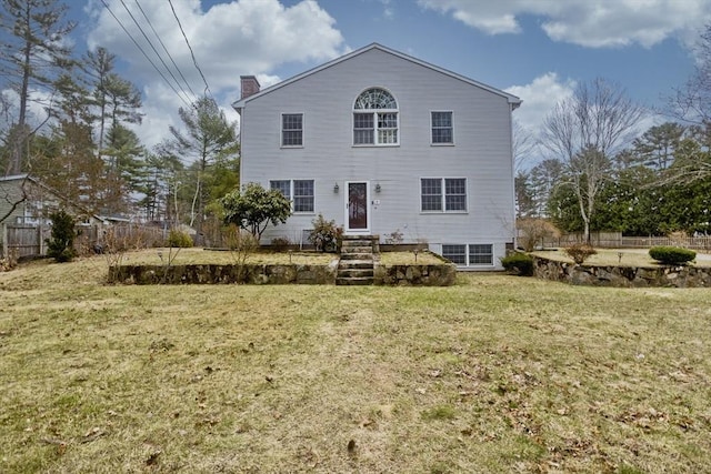16 Poole Rd, Belchertown, MA 01007 - view of front of home with a chimney, fence, and a front lawn