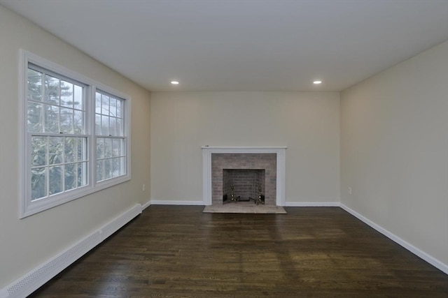 16 Poole Rd, Belchertown, MA 01007 - unfurnished living room with baseboards, recessed lighting, a baseboard heating unit, and dark wood-style floors