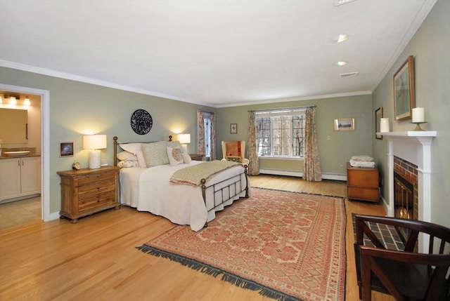 bedroom featuring a fireplace with flush hearth, visible vents, ornamental molding, and wood finished floors