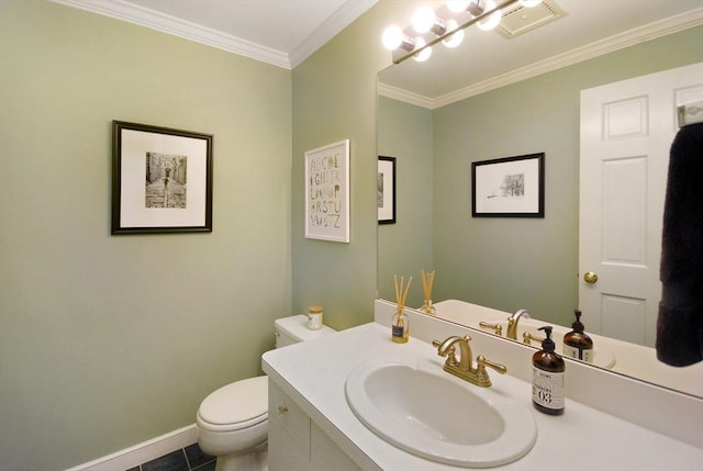 bathroom with toilet, vanity, baseboards, visible vents, and crown molding