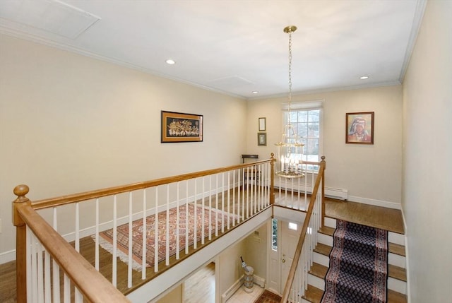 stairway featuring baseboards, wood finished floors, crown molding, and recessed lighting