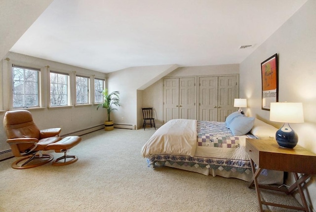 carpeted bedroom with visible vents and multiple closets