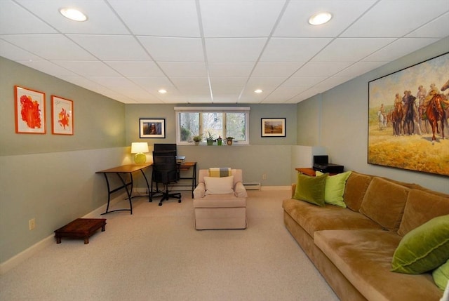 carpeted office with baseboard heating, recessed lighting, a paneled ceiling, and baseboards