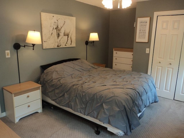 carpeted bedroom featuring a closet