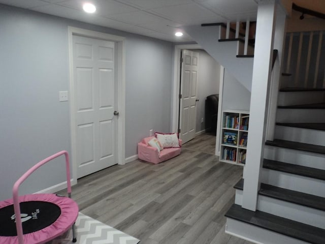 game room featuring wood finished floors, baseboards, and recessed lighting