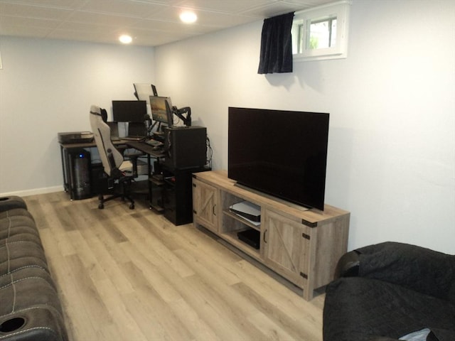 office area with a drop ceiling, light wood-style flooring, baseboards, and recessed lighting