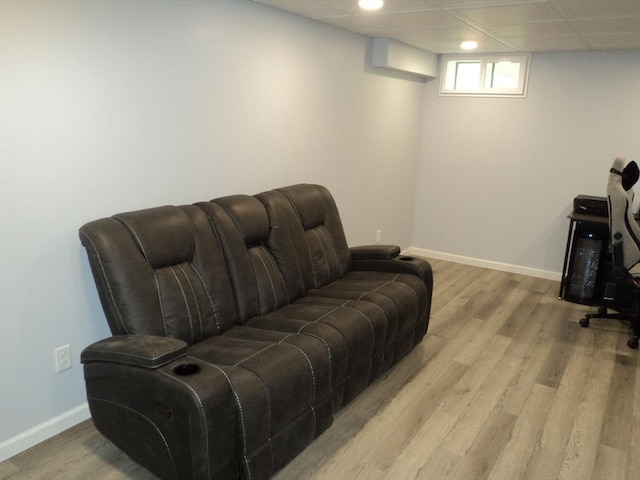 living area featuring wood finished floors and baseboards