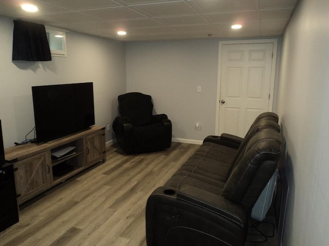 living area with recessed lighting, baseboards, and light wood-style floors