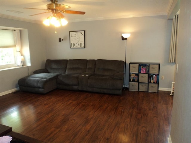 living area with ceiling fan, ornamental molding, baseboards, and wood finished floors