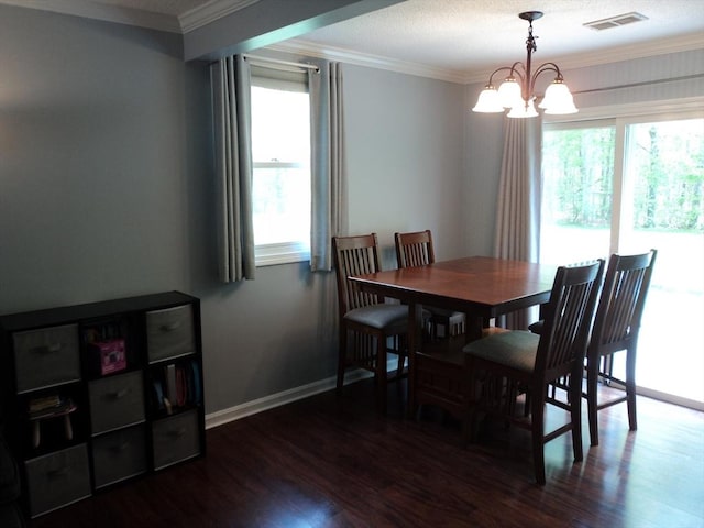 dining space with crown molding, visible vents, plenty of natural light, and dark wood-type flooring
