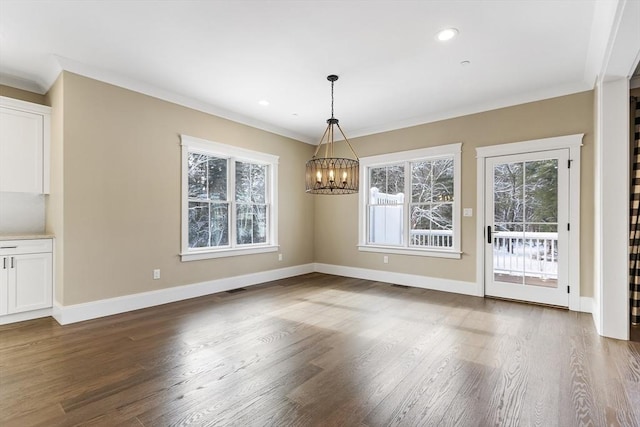 30 Southfield Ln Unit 30, Sherborn, MA 01770 - unfurnished dining area featuring a chandelier, wood finished floors, baseboards, ornamental molding, and recessed lighting