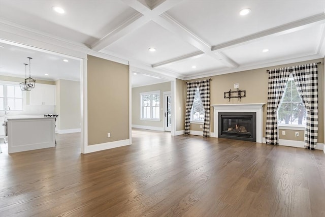 30 Southfield Ln Unit 30, Sherborn, MA 01770 - unfurnished living room featuring baseboards, a glass covered fireplace, wood finished floors, beam ceiling, and coffered ceiling