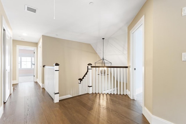 30 Southfield Ln Unit 30, Sherborn, MA 01770 - hallway featuring an upstairs landing, wood finished floors, a chandelier, and baseboards