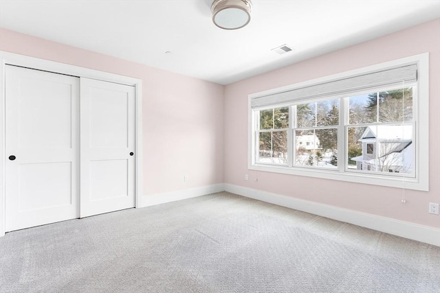 30 Southfield Ln Unit 30, Sherborn, MA 01770 - unfurnished bedroom featuring carpet flooring, baseboards, and a closet