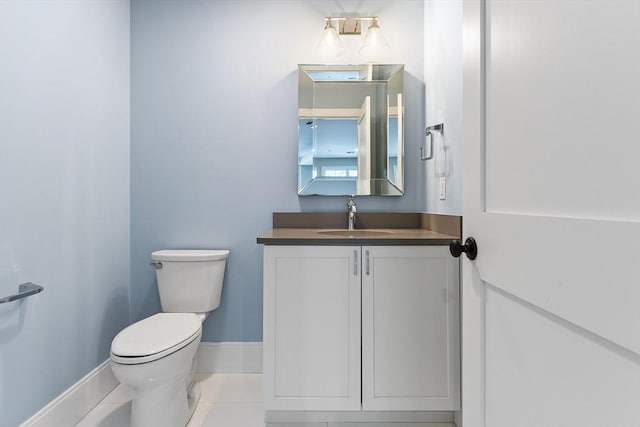 30 Southfield Ln Unit 30, Sherborn, MA 01770 - bathroom featuring toilet, vanity, baseboards, and tile patterned floors