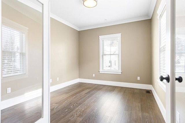 30 Southfield Ln Unit 30, Sherborn, MA 01770 - spare room featuring dark wood-style floors, ornamental molding, baseboards, and french doors