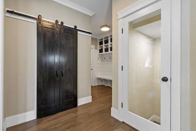 30 Southfield Ln Unit 30, Sherborn, MA 01770 - corridor with a barn door, dark wood-style flooring, and baseboards