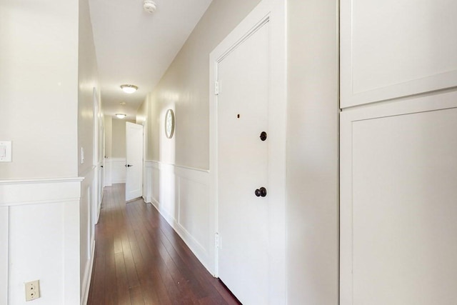 1834 Beacon St Unit 16, Brookline, MA 02445 - corridor featuring a wainscoted wall and dark wood-type flooring