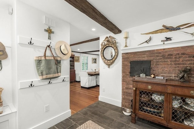 interior space with baseboards, visible vents, beam ceiling, and recessed lighting