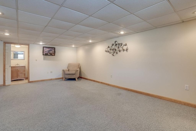 unfurnished room with carpet flooring and a paneled ceiling