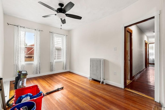 26 Enfield Rd, Winthrop, MA 02152 - workout area with radiator heating unit, hardwood / wood-style floors, and ceiling fan