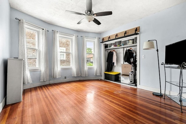 26 Enfield Rd, Winthrop, MA 02152 - unfurnished bedroom featuring hardwood / wood-style floors, a closet, and a ceiling fan