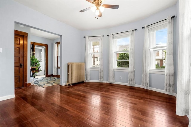 26 Enfield Rd, Winthrop, MA 02152 - spare room with radiator, a ceiling fan, and hardwood / wood-style flooring