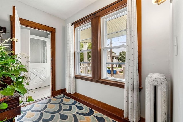 26 Enfield Rd, Winthrop, MA 02152 - doorway to outside with radiator heating unit and baseboards