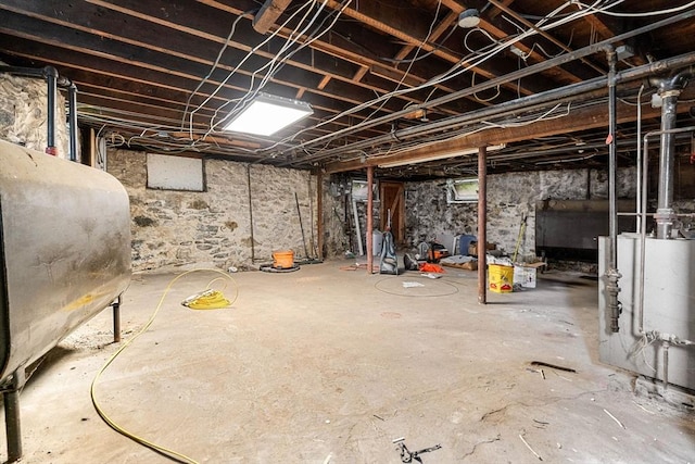 26 Enfield Rd, Winthrop, MA 02152 - unfinished basement featuring oil tank and water heater