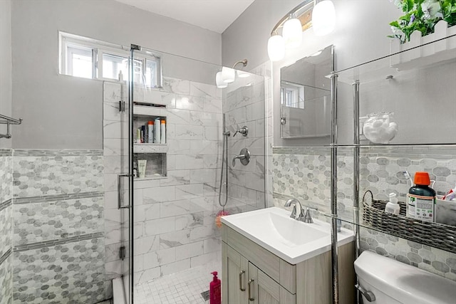 26 Enfield Rd, Winthrop, MA 02152 - full bathroom featuring tile walls, a stall shower, vanity, and wainscoting