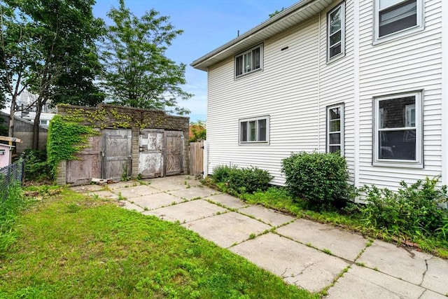 26 Enfield Rd, Winthrop, MA 02152 - back of house featuring a storage shed
