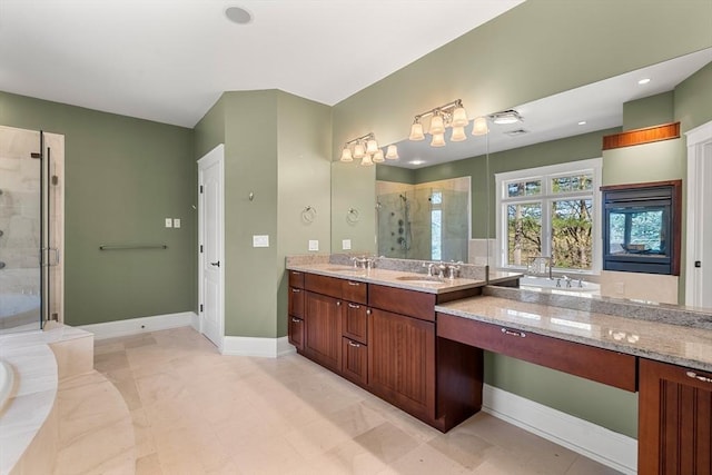 full bathroom with a garden tub, vanity, baseboards, and a stall shower