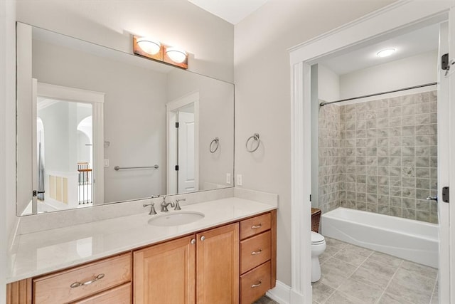 bathroom featuring vanity, toilet, and washtub / shower combination