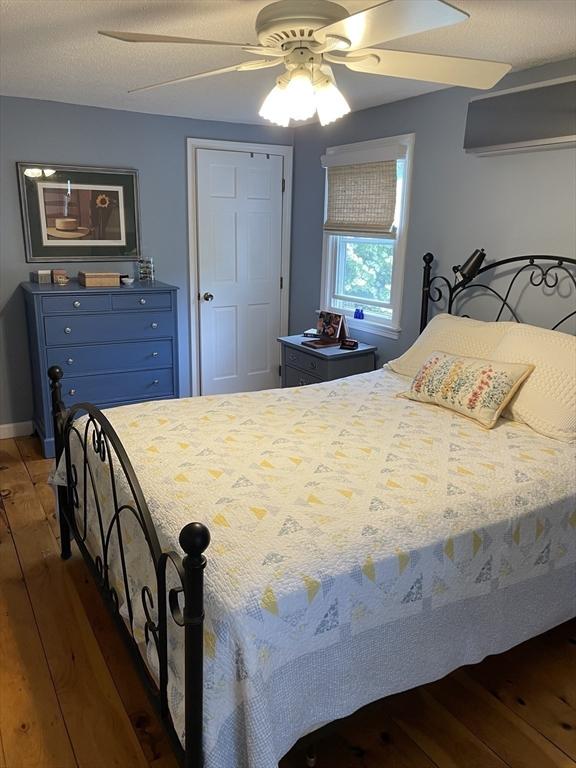 6 Jeffrey Ln, Freetown, MA 02702 - bedroom with hardwood / wood-style floors, a ceiling fan, and baseboards