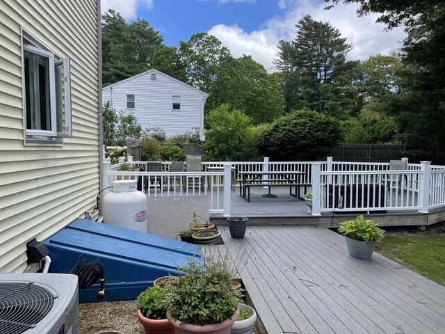 6 Jeffrey Ln, Freetown, MA 02702 - wooden deck featuring central AC and view of scattered trees