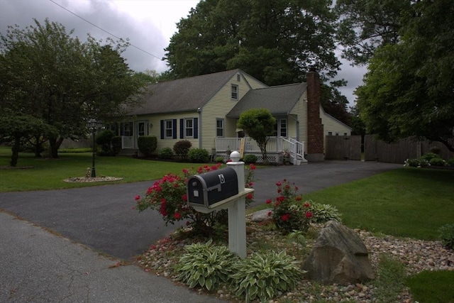 6 Jeffrey Ln, Freetown, MA 02702 - view of front of property featuring a chimney, driveway, and a shingled roof